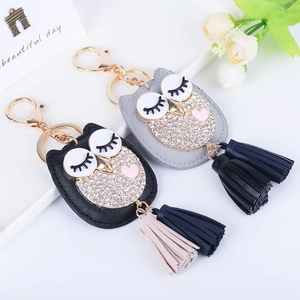 Porte-clés hibou chic en similicuir avec strass étincelants et pompons bicolores
