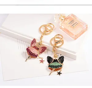 Detailed macro view of ballet fairy keychains with pink and green sparkling crystals