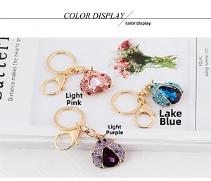 Detailed collection of crystal ladybug keychains in pink, blue, and purple tones