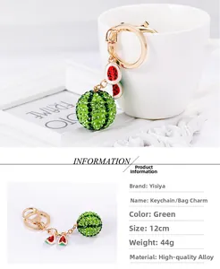 Detailed close-up of a sparkling rhinestone watermelon keychain with gold-tone hardware