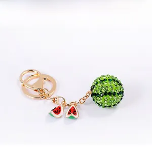 Detail of crystal fruit keychain with green rhinestones and watermelon charms