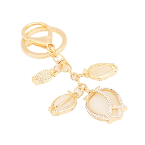Elegant gold flower keychain with opal-style petals and sparkling rhinestones accessories
