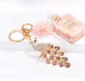 Detail of crystal peacock keychain with pink rhinestones and gold lobster clasp