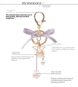 Close-up of bow keychain featuring hollow star, pearl pendants, and sparkling crystals