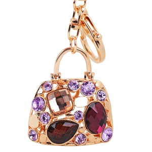 Luxury handbag keychain with purple and red rhinestones on a golden metal base