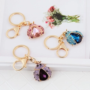 Chic ladybug crystal rhinestone keychains in pink, blue, and purple with gold finish