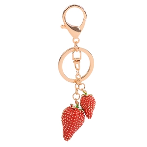 Squisito portachiavi a fragola in oro rosa con ciondoli in smalto rosso per borse