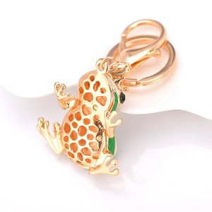 Porte-clés grenouille en or avec émail vert et design de couronne alvéolée