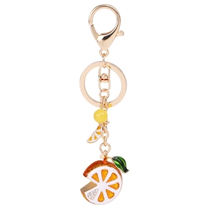 Sparkling crystal lemon orange slice keychain with gold clasp and tassel detail