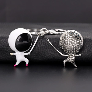 Fencing athlete keychain set featuring white enamel finish and silver hollow metal design