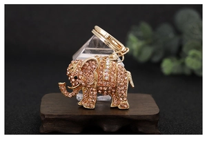 Detailed close-up of pink crystal elephant keychain with gold lobster clasp