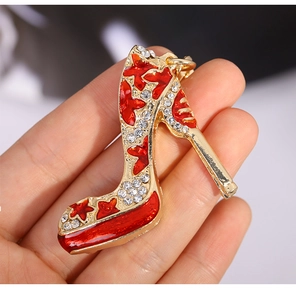 Detailed macro view of a red enamel high heel keychain with sparkling crystals