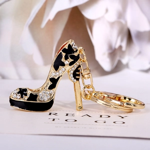 Golden high heel keychain with black enamel and sparkling rhinestones for bags