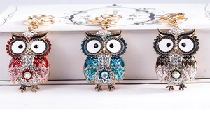 Detailed set of owl keychains with sparkling crystals and colorful enamel in three colors