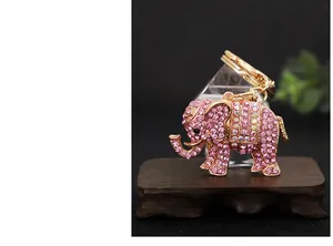 Detail of pink crystal elephant keychain with gold alloy finish and sparkling rhinestones