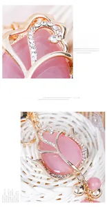 Macro detail of tulip keychain with pink opal stone, gold metal frame and rhinestones