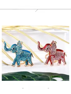 Detailed macro view of crystal-encrusted elephant keychain in gold-plated alloy finish