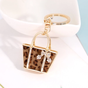 Leopard print mini handbag keychain with gold plating and sparkling rhinestones