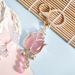 Pink opal tulip keychain with sparkling rhinestones on champagne gold alloy finish
