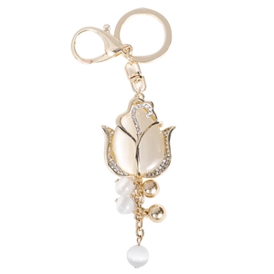 Golden tulip keychain with white opal stones and sparkling crystal accents for bags