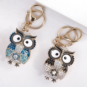 Sparkling crystal owl keychains in teal and brown with polished gold lobster clasps
