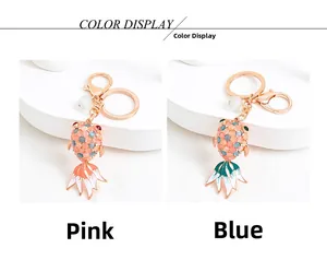 Detailed comparison of pink and blue opal goldfish keychains with sparkling crystals