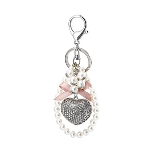 Sparkling crystal heart keychain with faux pearls and pink ribbon bow on silver ring