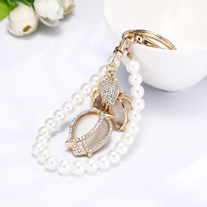 Elegant cat eye tulip keychain with faux pearls and sparkling rhinestones for backpacks