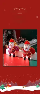 Detail view of Santa Claus keychains with red rhinestones and gold plating on festive background