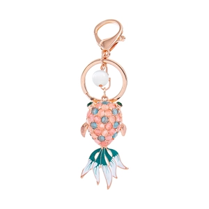 Exquisite goldfish keychain with cat-eye stone inlay and enamel fish tail detailing