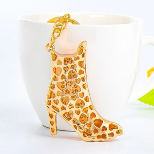 Fashionable gold high heel boot keychain with hollow heart patterns for bag charm