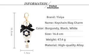 Detailed spec sheet of camellia bow keychain with pearl beads and perfume bottle charm