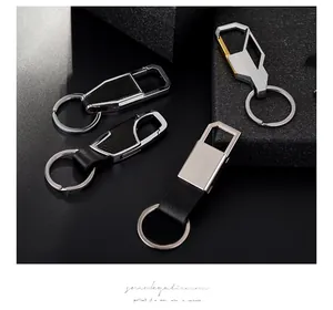 Detail showing four premium metal and leather car keychains in various industrial designs