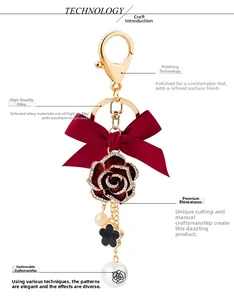 Detail view of red velvet bow keychain with rose pendant and polished gold alloy hardware
