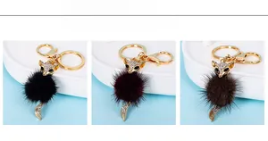 Three colors of fox faux fur keychains with sparkling crystals and golden alloy hardware
