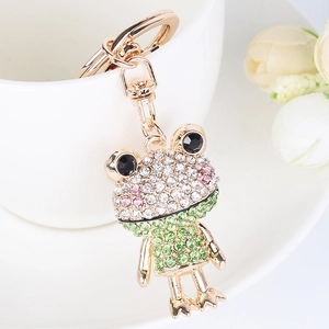 Close-up of a sparkling green rhinestone frog keychain with gold-plated lobster clasp