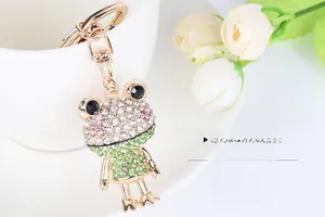 Detailed view of frog keychain featuring colorful rhinestones on a gold metal base