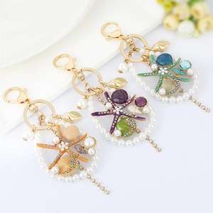 Marine starfish keychains with rhinestone tassels, shells, and pearls in three colors
