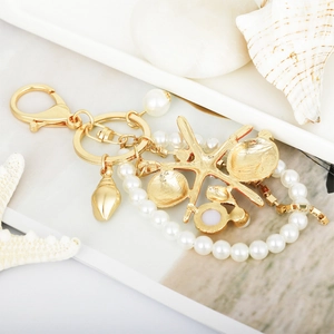 Starfish and seashell keychain with white pearls and golden lobster clasp for bags