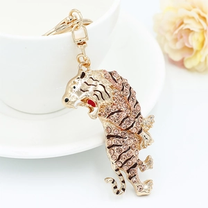 Sparkling tiger keychain with champagne rhinestones on a gold-plated zodiac pendant