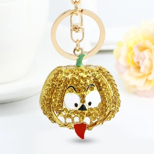 Creative Halloween pumpkin keychain with yellow crystals and cartoon face charm