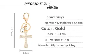 Detail view of gold cross keychain with rhinestones showing dimensions 13.3cm by 4.6cm