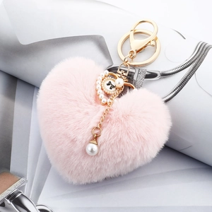 Pink heart plush keychain with faux fur, gold lobster clasp, pearls and bow detail