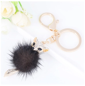 Chic fox head keychain with sparkling rhinestones and a black fluffy mink fur pompom