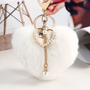 Fluffy cream heart plush keychain with golden metal ring and pearl heart frame detail