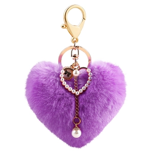 Purple plush heart keychain with gold clasp, faux pearls and bow detail decoration