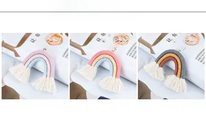 Detailed view of handmade bohemian rainbow keychains with colorful tassels and gold clips