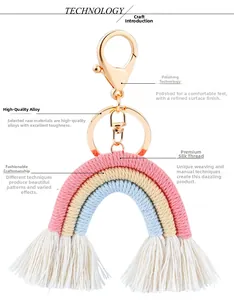 Detail of handmade rainbow tassel keychain with gold lobster clasp and white fringes