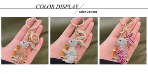 Detailed view of three-color rhinestone bunny keychains in gold, AB color, and purple-pink