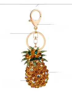 Detailed close-up of sparkling crystal pineapple keychain with vibrant yellow and green rhinestones